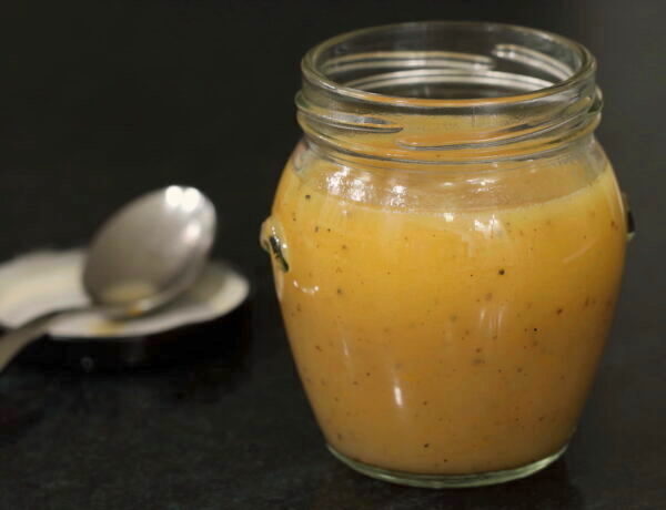 Jar of orange ginger vinaigrette