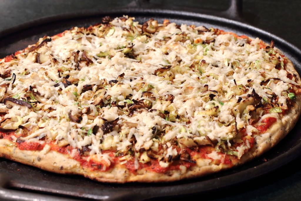 Brussels sprouts and shiitake pizza on cast iron pan