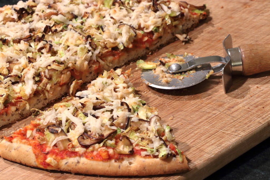 Slicing pizza with a pizza cutter