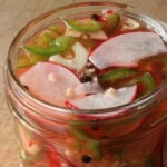 Close-up, top-view of Spicy Pickled Radishes with Jalapeños