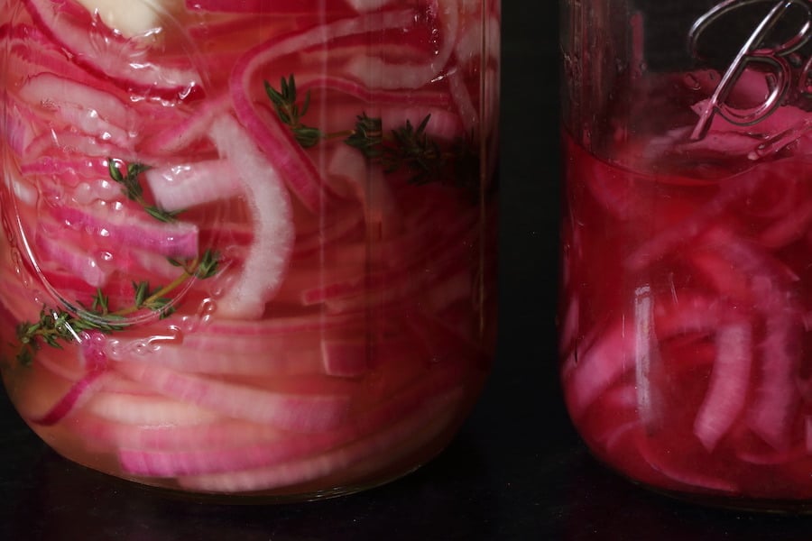 Two mason jars of Pickled Red Onions (no sugar)