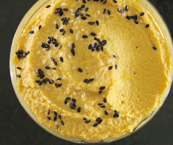 Close up Roasted Golden Beet Hummus with roasted black and white sesame seeds