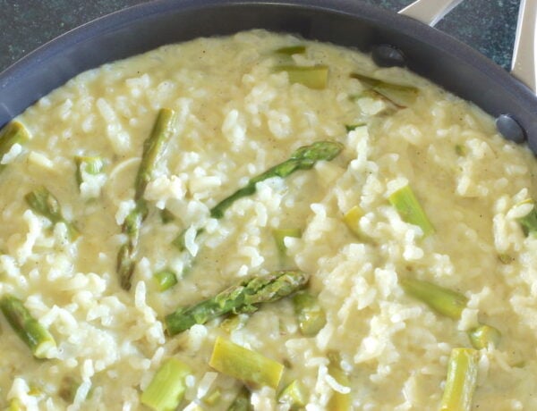 Asparagus risotto cooked in a large skillet