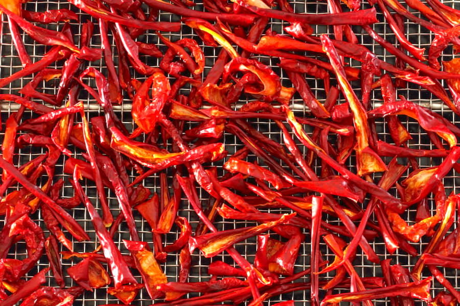 A tray of dehydrated paprika pepper strips