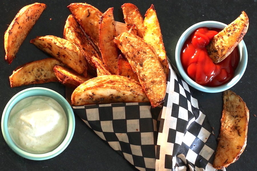 Extra Crispy Baked Garlic & Herb Potato Wedges - Baker by Nature