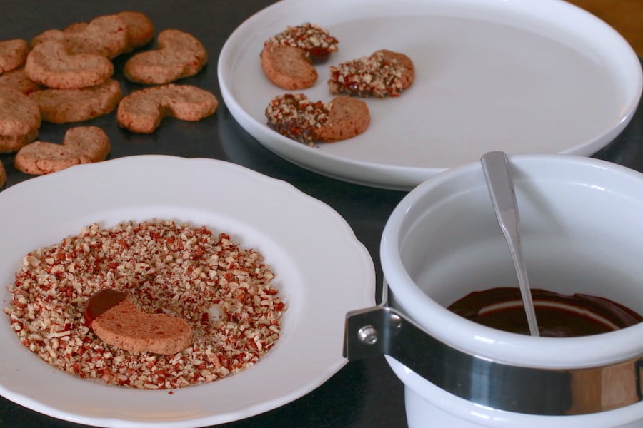 Dipping Pecan Cookies in Chocolate