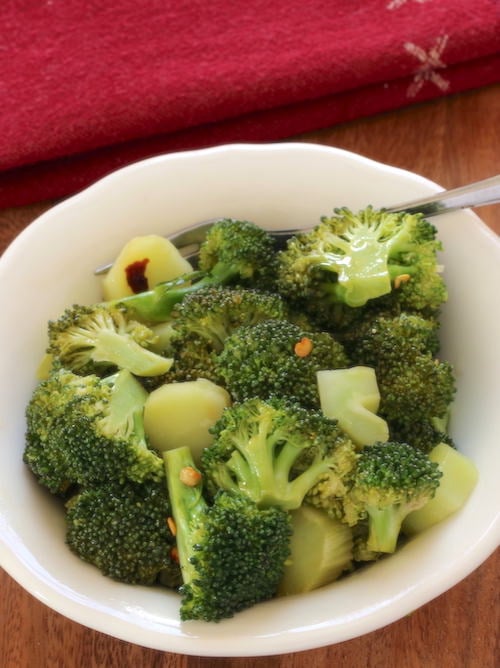 Broccoli Salad in a serving bowl with a napkin in the rear