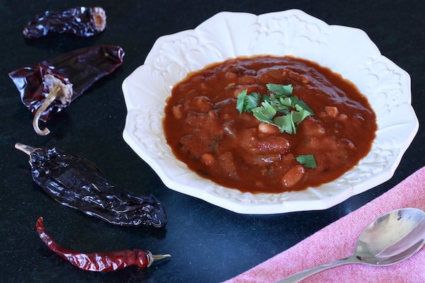 Bowl of Chili Recipe Vegan with arrangement of dried chile peppers