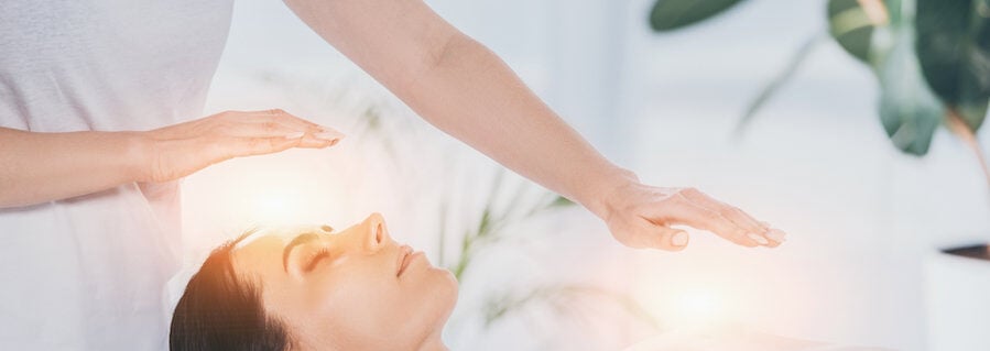 Woman receiving energy healing