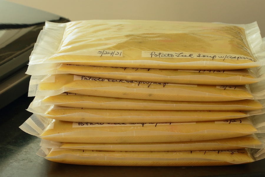 Flat packages of soup ready for the freezer