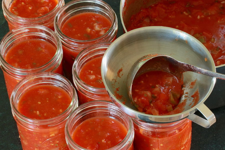 https://alifewellplanted.com/wp-content/uploads/2021/09/Pouring-salsa-in-jars.jpg