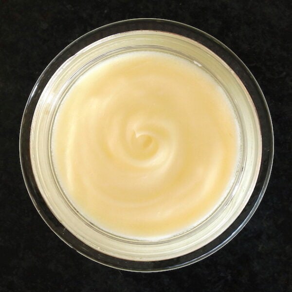 Top-down, close-up view of open jar of Rose Cream