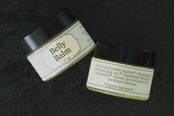 View of front and back labels of 2 oz jar of hand made Belly Balm